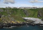 Whinnyfold  Whinyfold is a small clifftop village.  There is a wonderfuly shingle cove which you can reach down a steep cliff path.