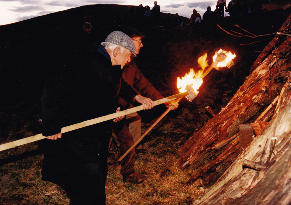 Alf lit a bnecon on Dollar Hill to commemorate the 50th anniversary of VE Day